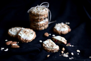 Pile of oatmeal, cranberry and white chocolate cookies. Selective focus.
