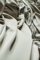 Smooth elegant grey silk or satin texture can use as background