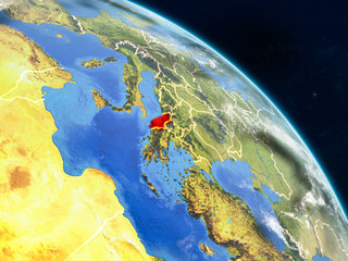 Albania from space on realistic model of planet Earth with country borders and detailed planet surface and clouds.