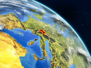 Fototapeta premium Switzerland from space on realistic model of planet Earth with country borders and detailed planet surface and clouds.