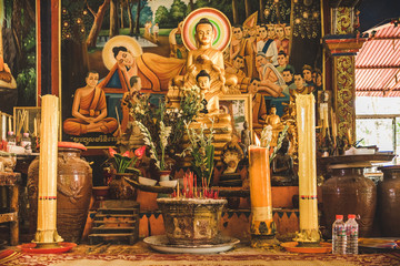 buddhist altar with candles and incense of buddha