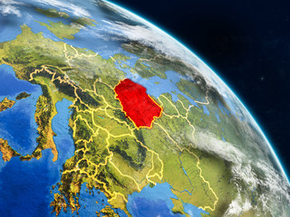 Poland from space on realistic model of planet Earth with country borders and detailed planet surface and clouds.