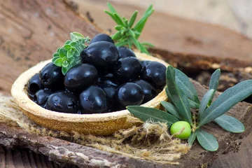 Foto op Plexiglas black olives in a bowl © Mira Drozdowski