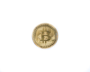 Golden bitcoin isolated on white background. Physical bit coin