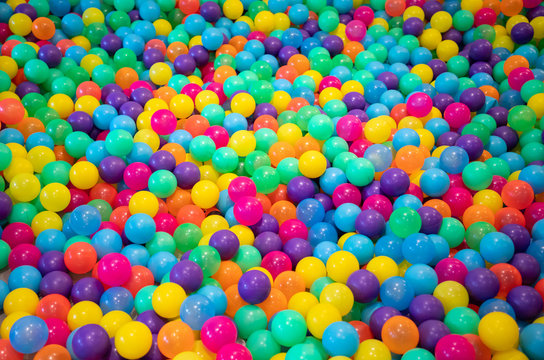 colourful plastic balls background for kid activity in indoor playground.