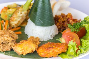Nasi Campur Bali served on a banana leaf