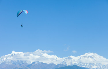 Fototapeta na wymiar Paragliding over Pokhara, Nepal