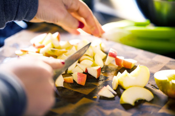 Young Woman Cooking in the kitchen. Healthy Food for Christmas (stuffed duck or Goose)