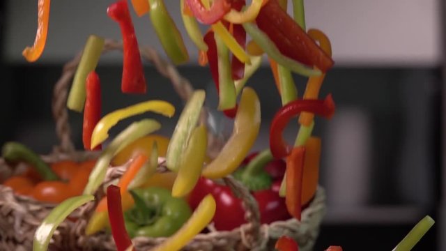 Sliced bell pepper being dropped wood, Slow motion 480 fps. Shot on sony rx 10