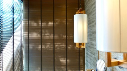 Evening sun light outside and wooden window blinds, sunshine and shadow on window blind, decorative interior home concept