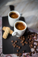 Two espresso with cookies, selective focus, small focal sharpness...