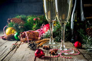 Two glasses of champagne with Christmas decoration on wooden background, Happy New Year and Xmas Celebration. Copy space