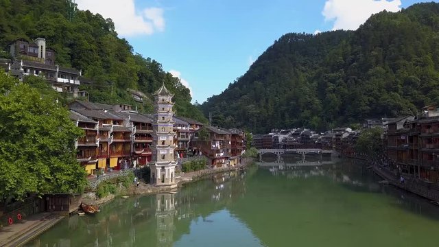 Riverside view. Peaceful sailing from an old boat at Phoenix Ancient Town, China, Hunan