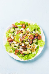 Chickpea cherry tomato goat cheese salad. Top view, space for text.