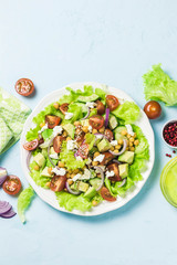 Chickpea cherry tomato goat cheese salad. Top view, space for text.