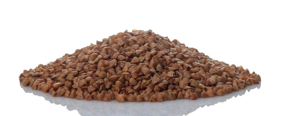 Buckwheat groats heap on white isolated background. porridge. healthy food. cereals.