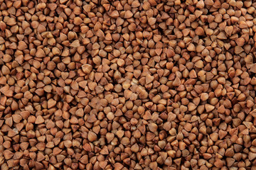 Background of buckwheat closeup. cereals. healthy food. porridge. place for inscription.