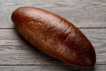 Brown rye bread on table