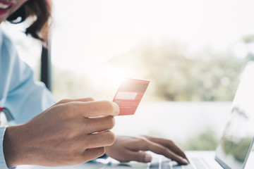 Happy woman doing online shopping with credit card at home, Online Payment Concept.