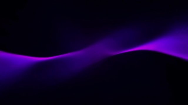 Abstract liquid light patterns ripple and flow (Loop).