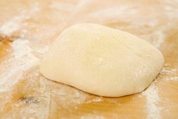 Yeast dough on floured surface