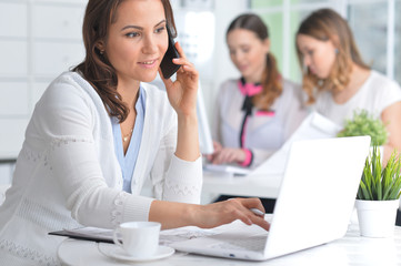 Obraz premium Portrait of young women working in modern office