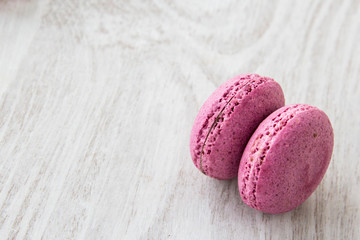 Delicious macaroons on white background