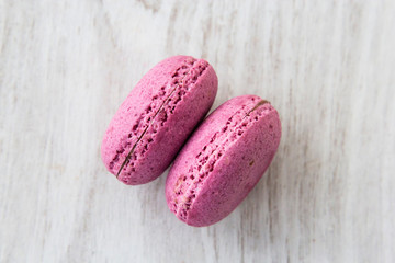 Delicious macaroons on white background