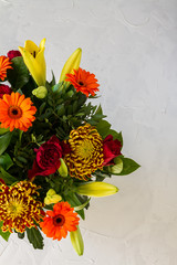 Orange, yellow and red flowers bouquet. White backround.