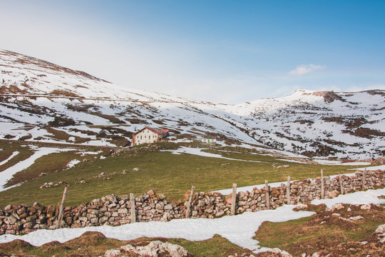 Beautiful remote house on slope of snowy mountains