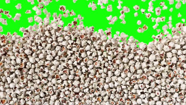 Popcorn falling down from top, fast food background texture pattern. Salty pop corn on green screen.