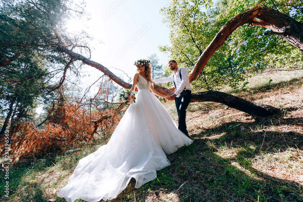 Wall mural happy bride and groom on nature. rustic wedding.