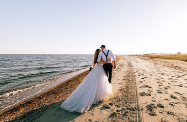 bride and groom on the seashore. wedding concept on the sea, on a fabulous island.