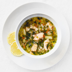 salmon soup decorated with lemon slices