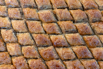 Baklava sliced with diamond shape. Can be used for design, websites, interior, background, backdrop, texture creation, the use of graphic editors, illustration, to create seamless textures.