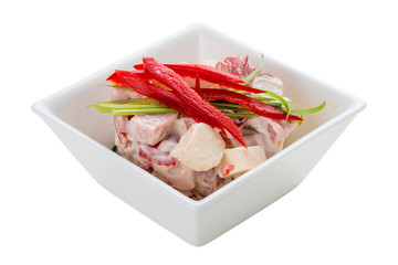 Salad with cabbage, ham and greens. On a white background