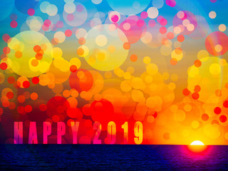 Happy new year 2019 banner with the text happy 2019 written on the horizon line of sea at sunset,...