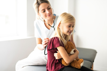 A cute Child Patient Visiting Doctor's Office