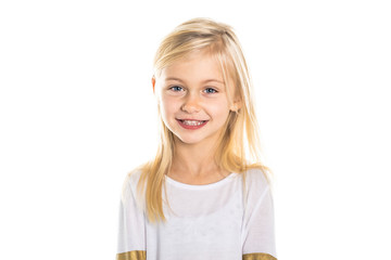 A Cute girl 5 year old posing in studio