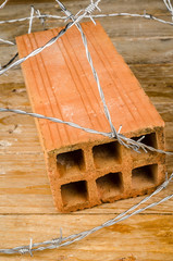Brick and barbed wire: the wall