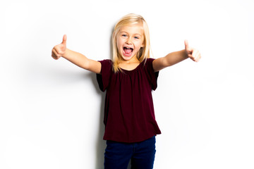A Cute girl 5 year old posing in studio