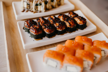 Philadelphia roll sushi cucumber, avocado, cream cheese, red caviar. Sushi menu