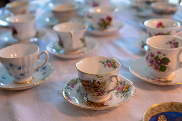 Obraz na płótnie Canvas Tea cups on a table with white tablecloth
