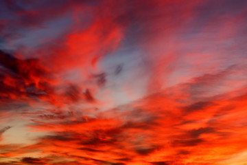 Dramatic sunset sky with blue and red clouds