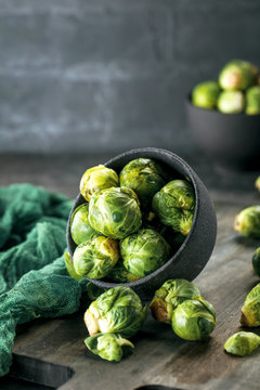 Fresh Raw Brussels Sprouts On A Wooden Table