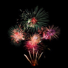 Obraz premium Colourful Fireworks at night isolated over dark black sky