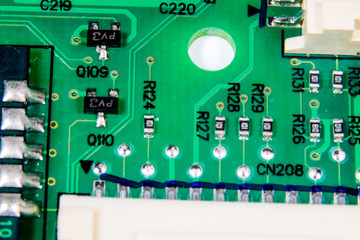 Macro photography of chip resistors on printed circuit board.