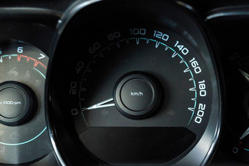 Close up image of a modern car speedometer