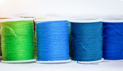 The roll of colorful thread on background,show texture of thread,forneedlework,craft,sewing and tailoring concept