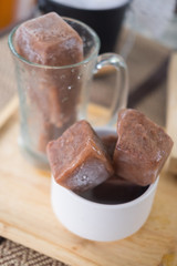 Ice cubes made with cocoa in a glass (Homemade drink)